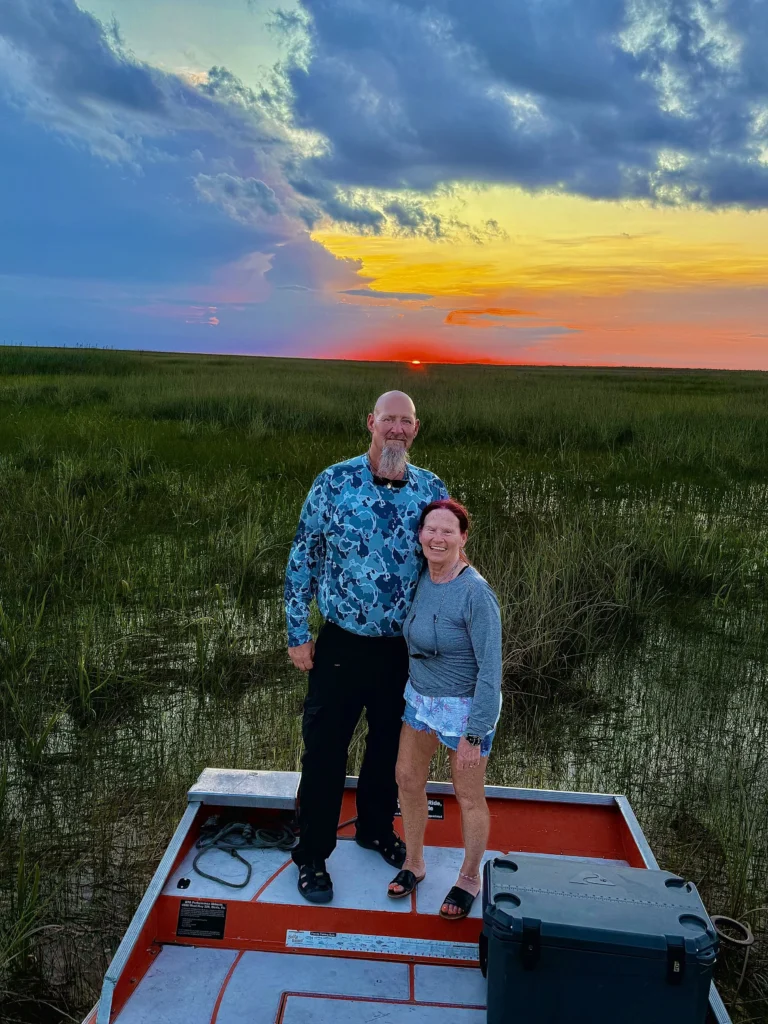 Couple on a private airboat at an Everglades sunset