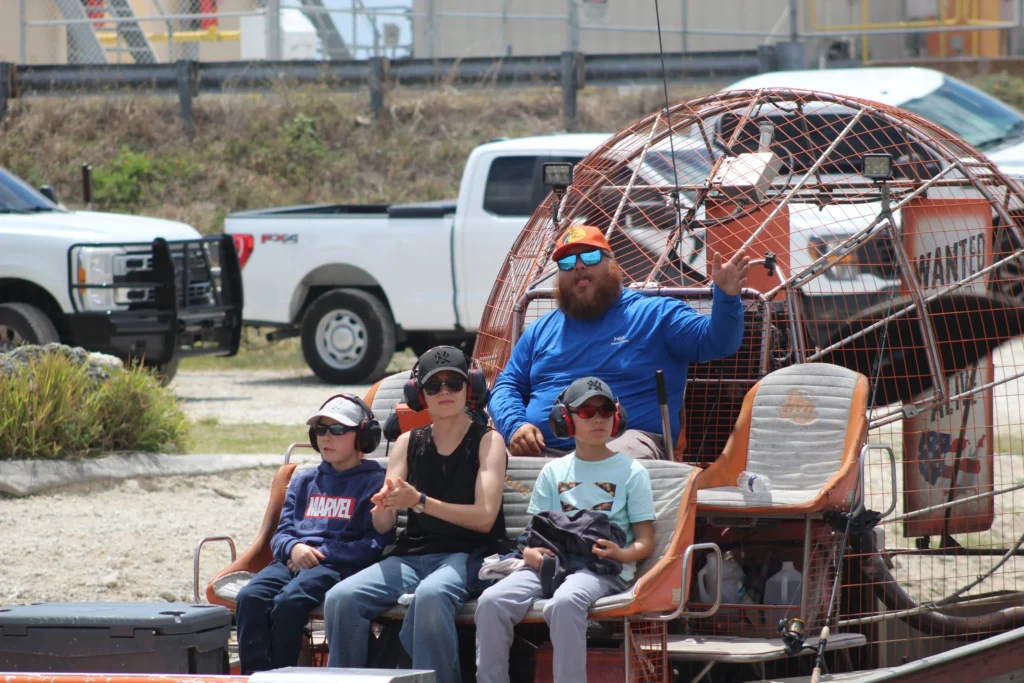 Group seated on an airboat ready for an Everglades tour