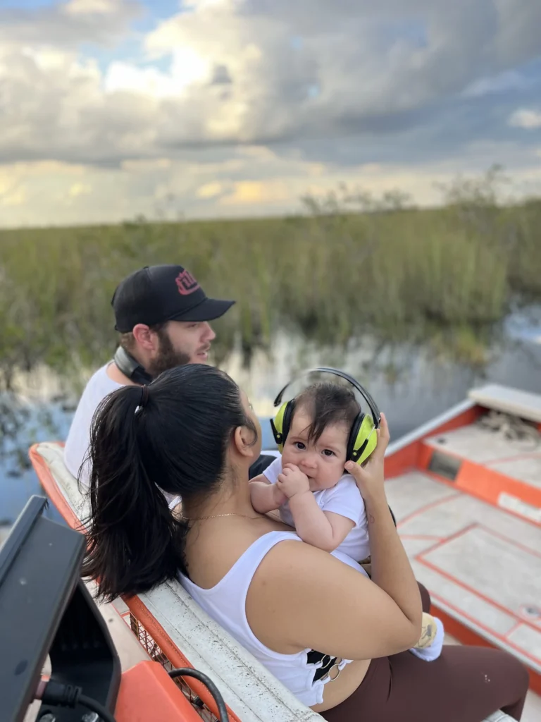 Parent and child on a private Everglades airboat