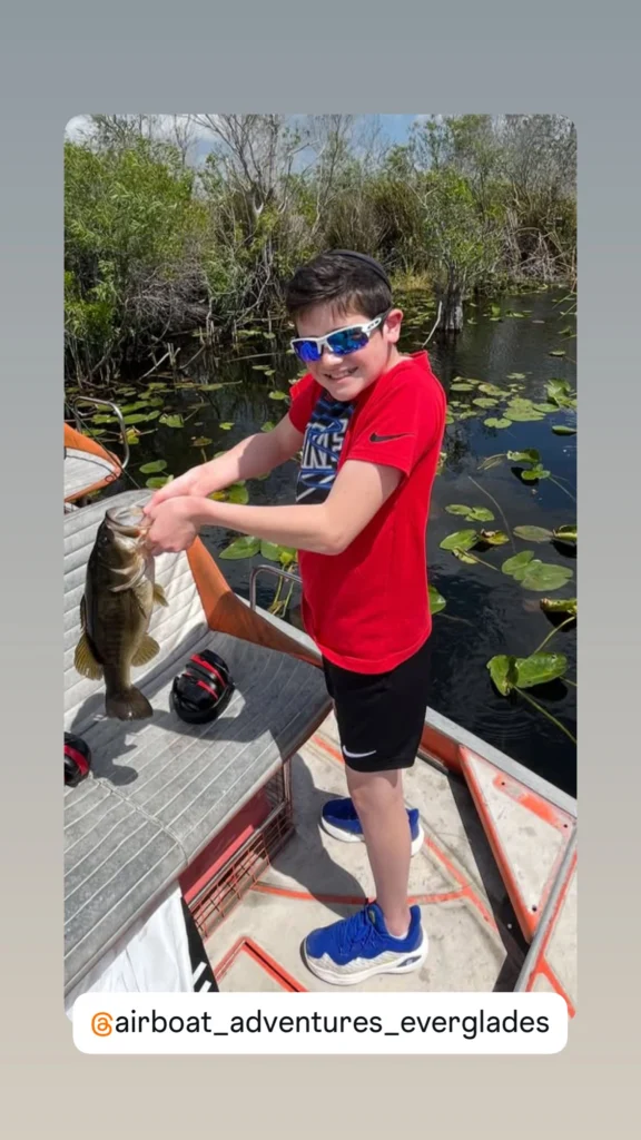 Young angler showing off a fish on a private Everglades airboat