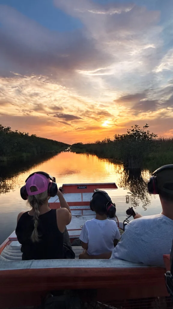 Guests watching the sunset from a private Everglades airboat