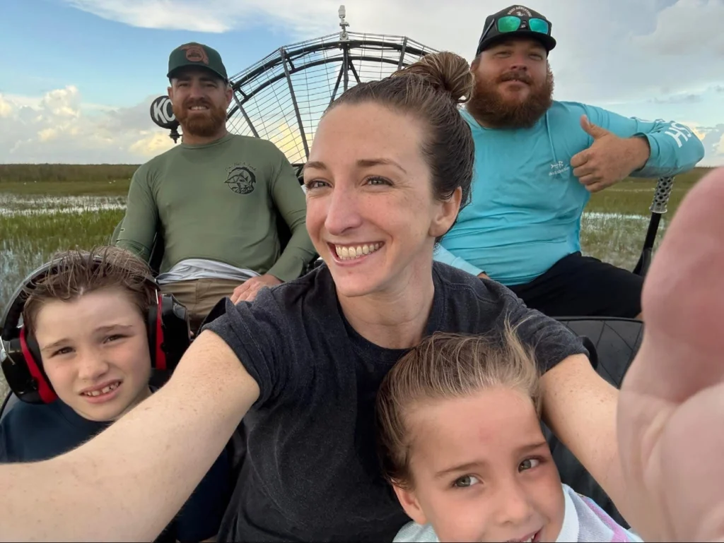 Family selfie on a private Everglades airboat with the captain