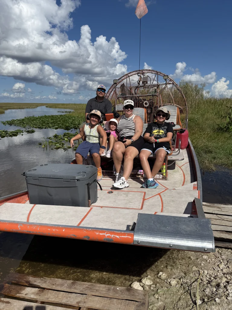 Group aboard a private airboat at the Everglades dock