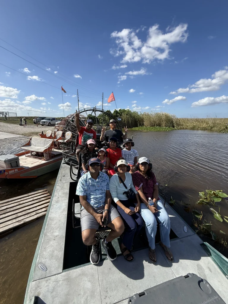 Large group aboard Everglades airboats at the dock